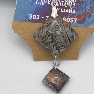 Acrylic skin dangle pendant.